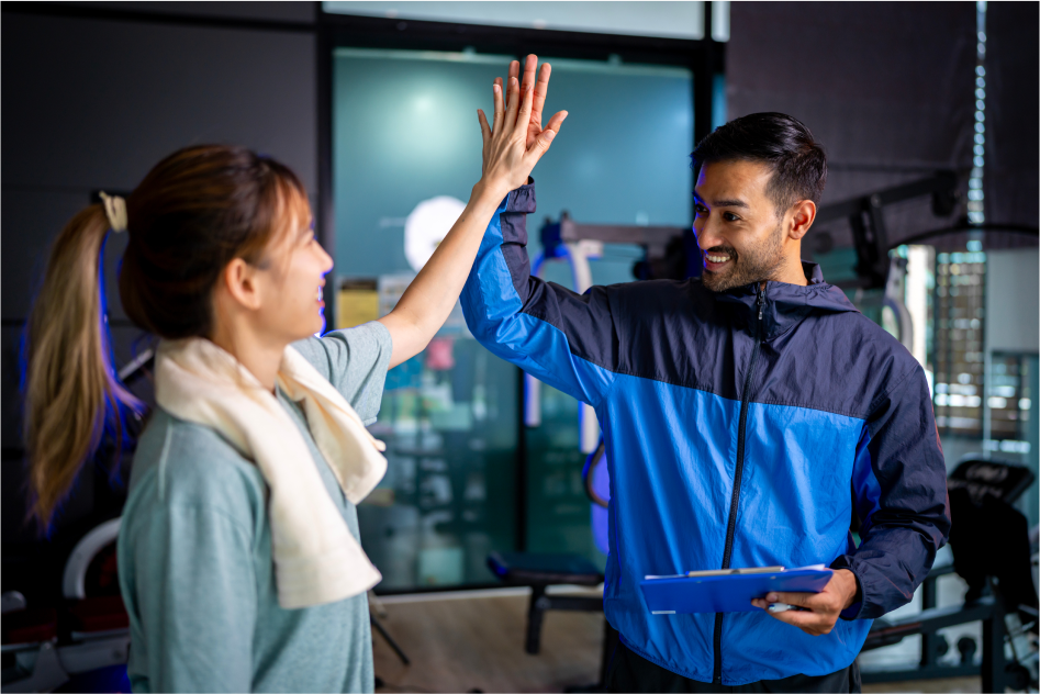 Plus10 team members giving high-five showing teamwork and trust